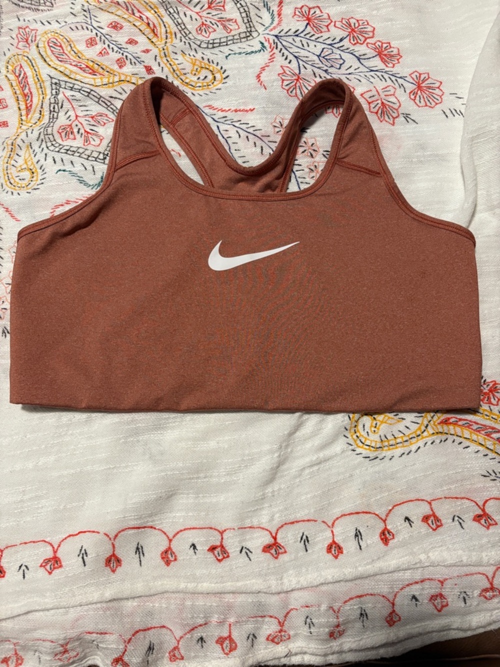 Nike Rust-Colored Racerback Sports Bra with White Swoosh